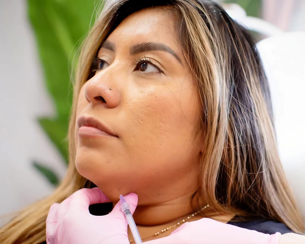 Woman Receiving Injection Under Her Chin